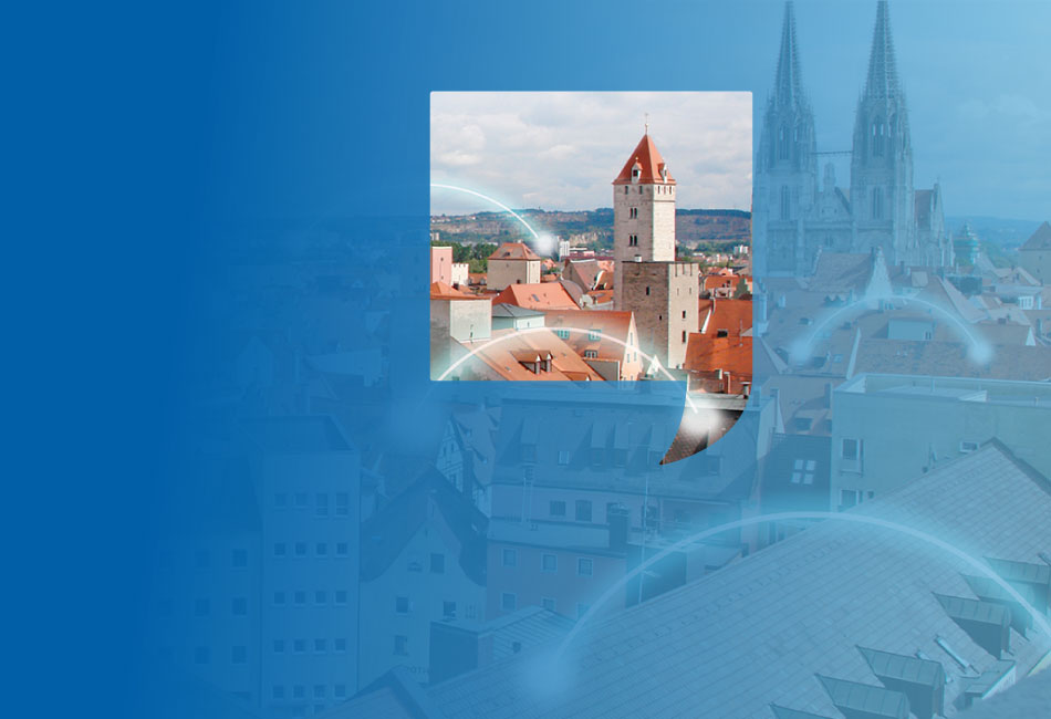 Luftbild von Regensburg mit verbindenden Lichtblitzen zwischen den Häusern, die Internetverbinudngen symbolisieren.
