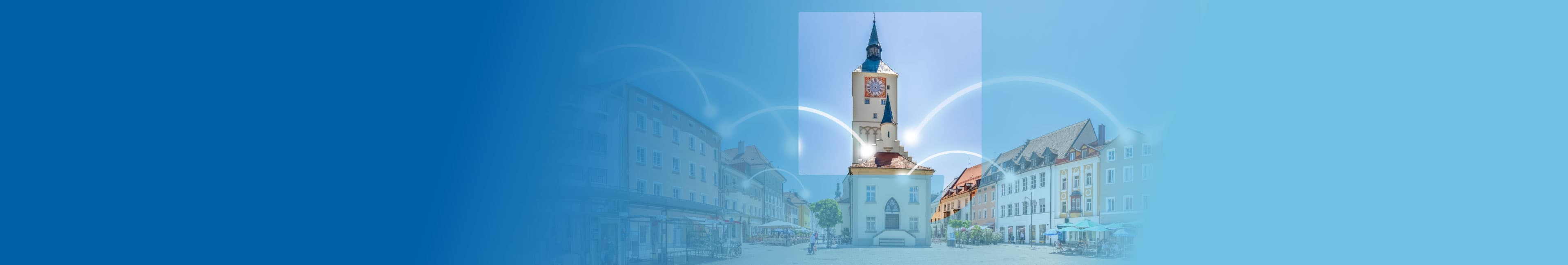 Luftbild von Regensburg mit verbindenden Lichtblitzen zwischen den Häusern, die Internetverbinudngen symbolisieren.