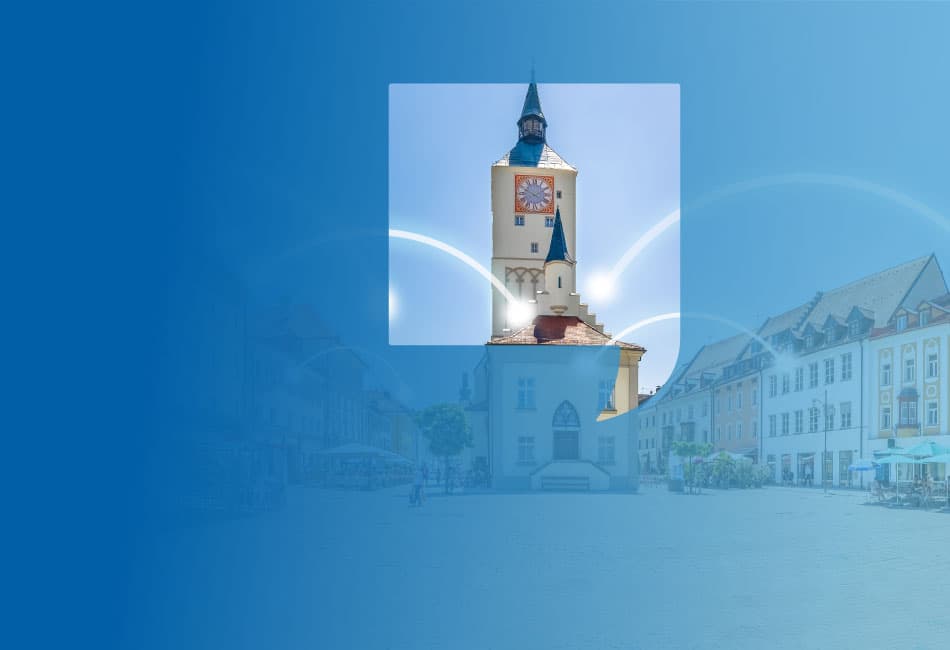 Luftbild von Regensburg mit verbindenden Lichtblitzen zwischen den Häusern, die Internetverbinudngen symbolisieren.